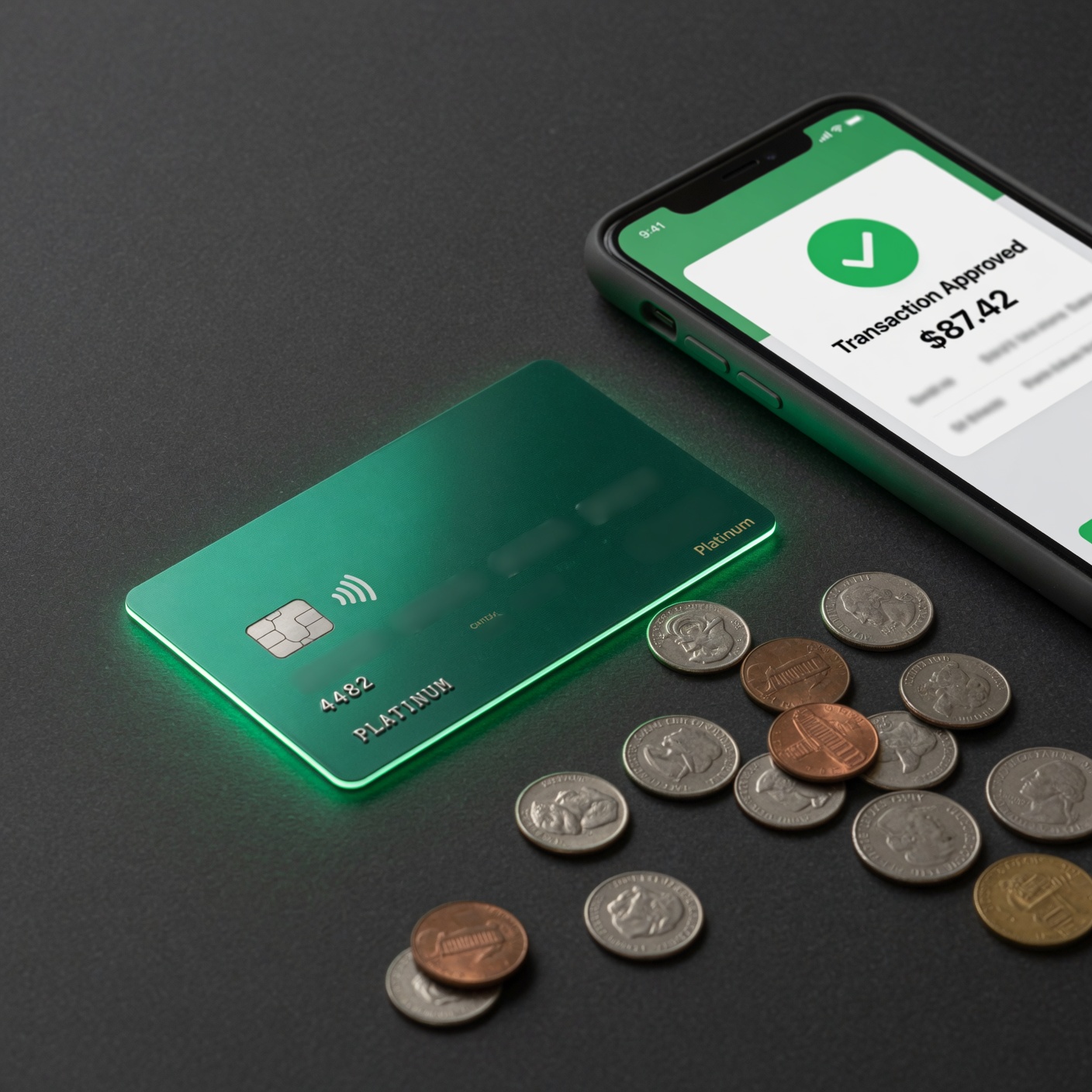 Emerald card and phone showing transaction approved